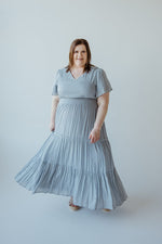 TIERED FLUTTER SLEEVE DRESS IN CHAMBRAY BLUE
