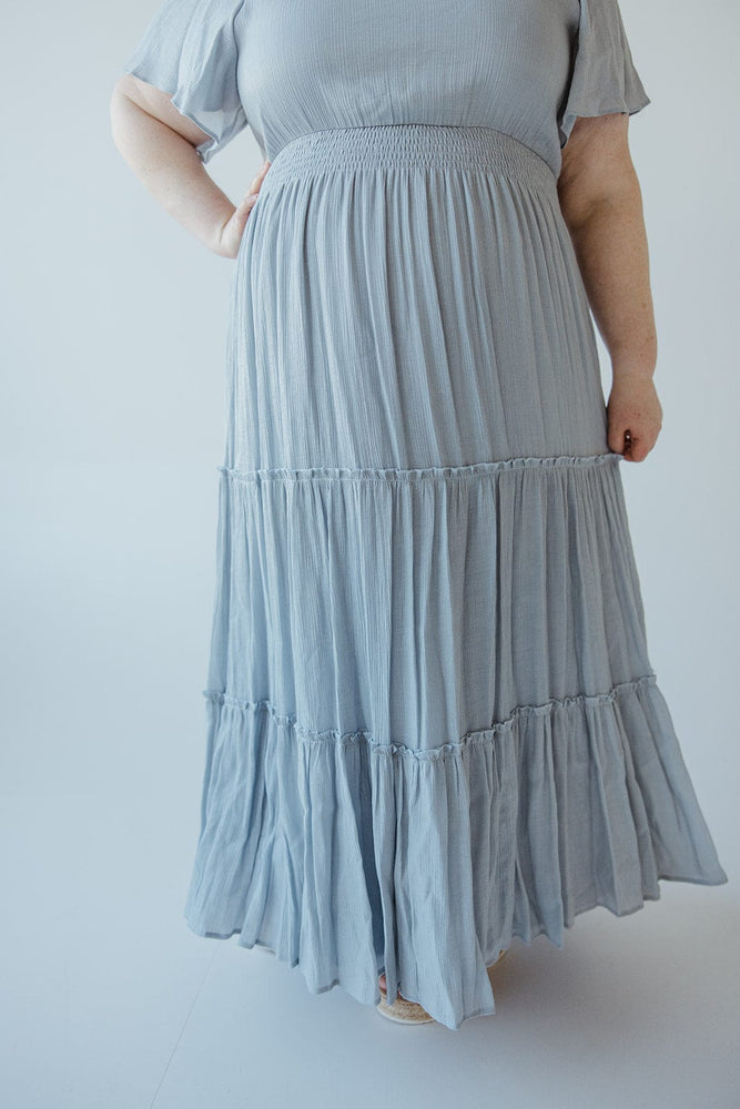 TIERED FLUTTER SLEEVE DRESS IN CHAMBRAY BLUE