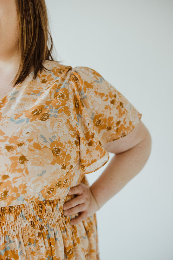 TIERED FLUTTER SLEEVE FLORAL DRESS IN AMBER SUNSET