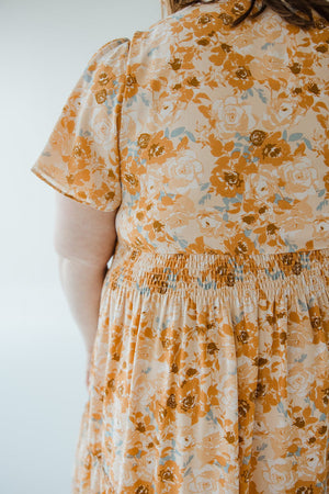 TIERED FLUTTER SLEEVE FLORAL DRESS IN AMBER SUNSET