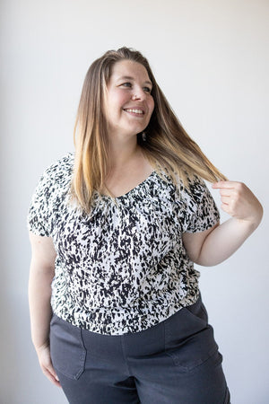V-NECK TUNIC WITH ABSTRACT ANIMAL PRINT DETAIL