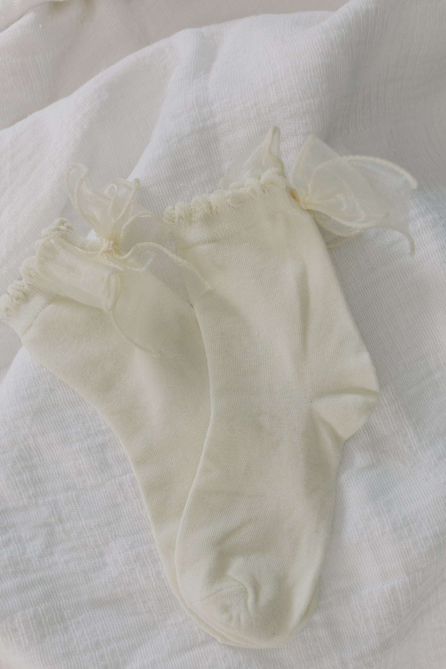 White socks with ruffles on a white background