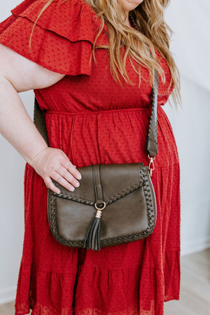 
            
                Load image into Gallery viewer, WHIPSTITCH FLAP-OVER CROSSBODY WITH TASSEL IN DARK OLIVE
            
        