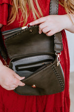 WHIPSTITCH FLAP-OVER CROSSBODY WITH TASSEL IN DARK OLIVE