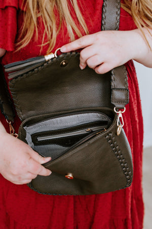 
            
                Load image into Gallery viewer, WHIPSTITCH FLAP-OVER CROSSBODY WITH TASSEL IN DARK OLIVE
            
        