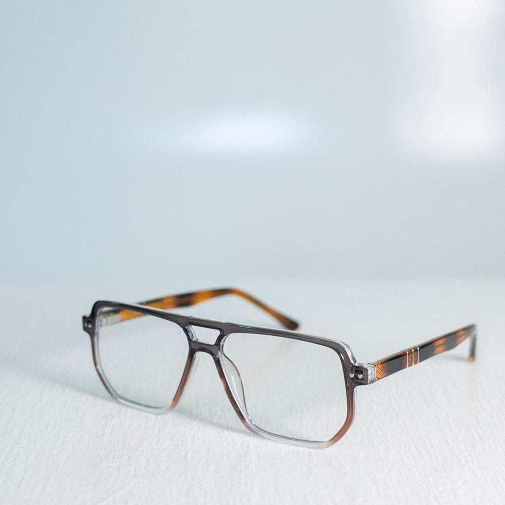 Blue light glasses with a tortoiseshell frame on a light gray background