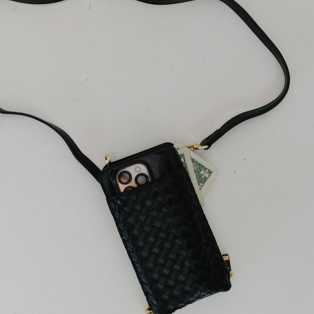 Black woven phone pouch with a strap on a light gray background