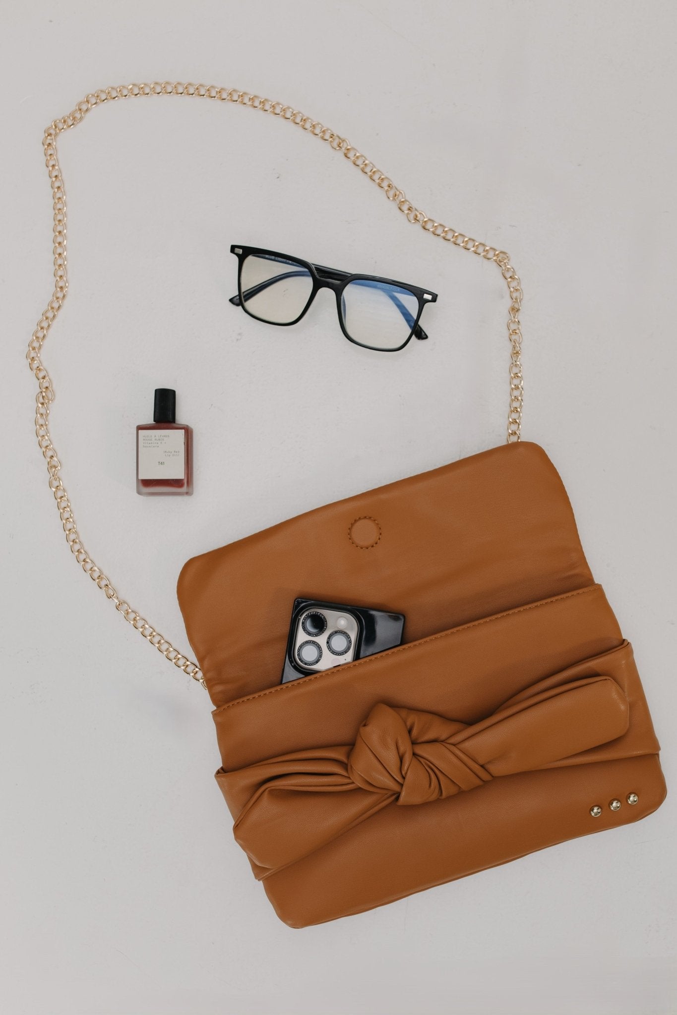 BOW CONVERTIBLE CLUTCH 3 - IN - 1 STATEMENT BAG IN BROWN - Love Marlow