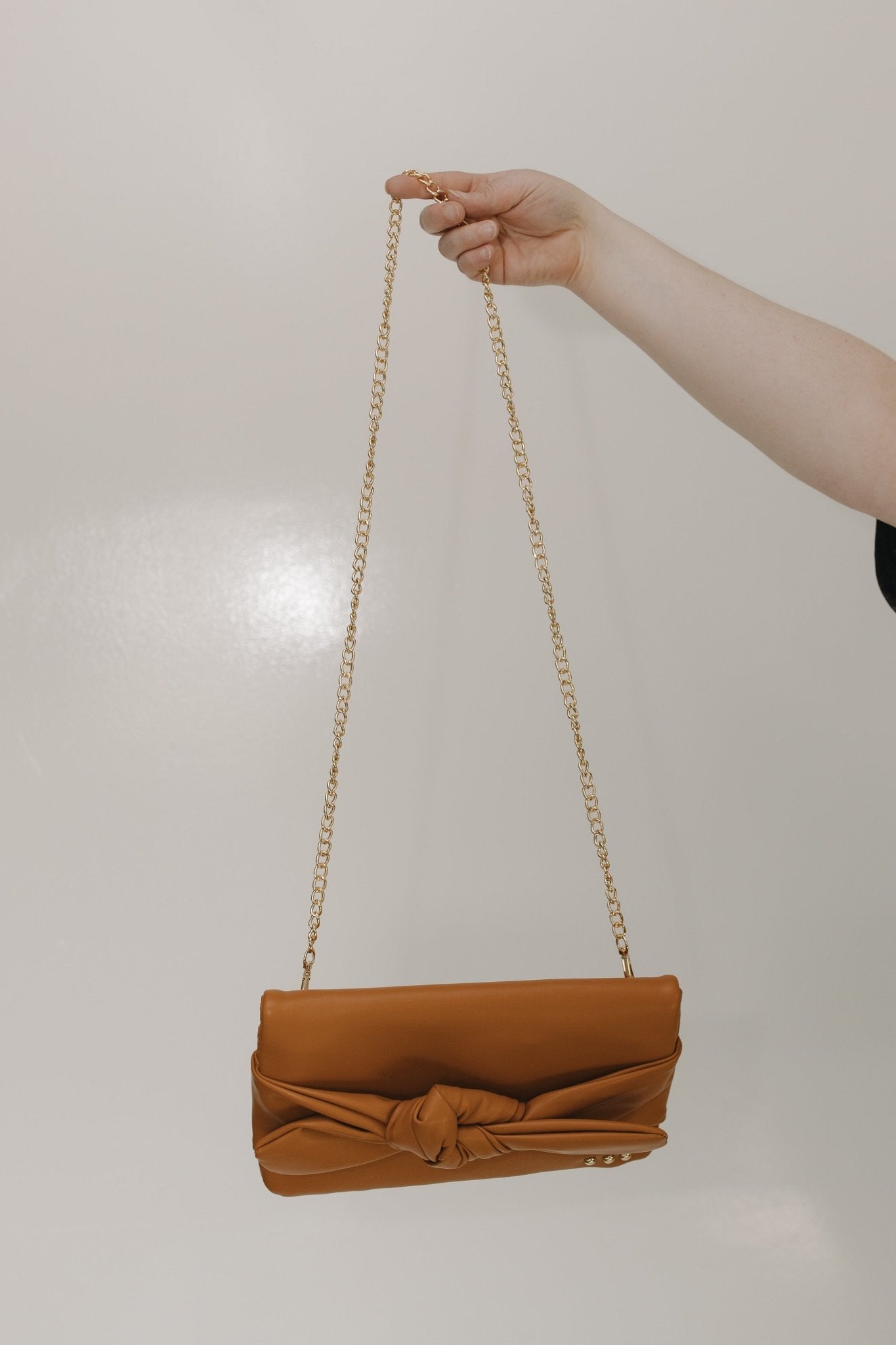 BOW CONVERTIBLE CLUTCH 3 - IN - 1 STATEMENT BAG IN BROWN - Love Marlow