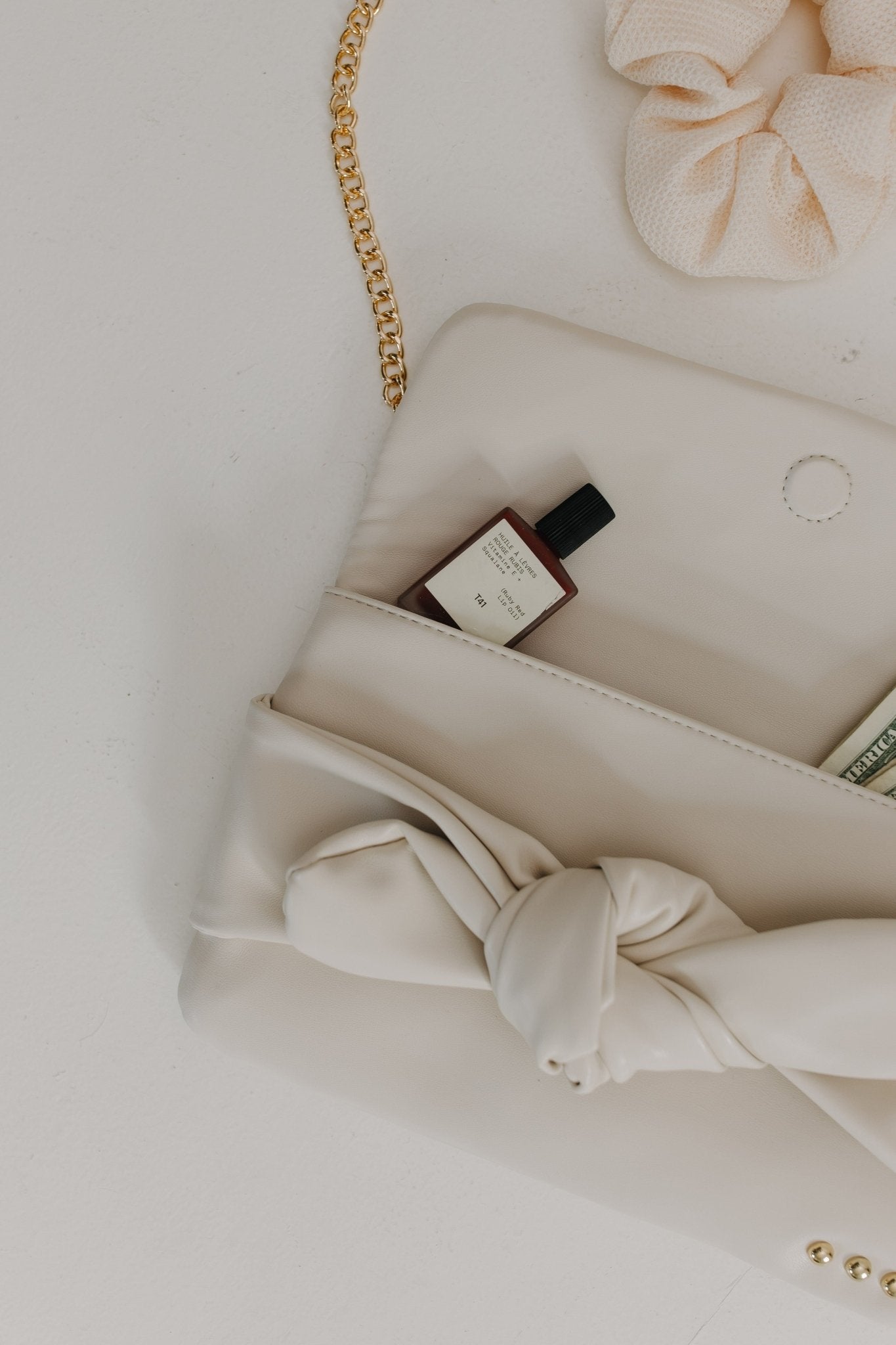 BOW CONVERTIBLE CLUTCH 3 - IN - 1 STATEMENT BAG IN CREAM - Love Marlow