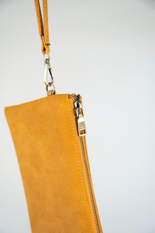 FAUX SUEDE CLUTCH IN MUSTARD - Love Marlow