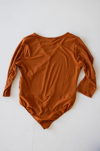FAUX WRAP BODYSUIT WITH SIDE RUCHING IN AMBER GLOW - Love Marlow