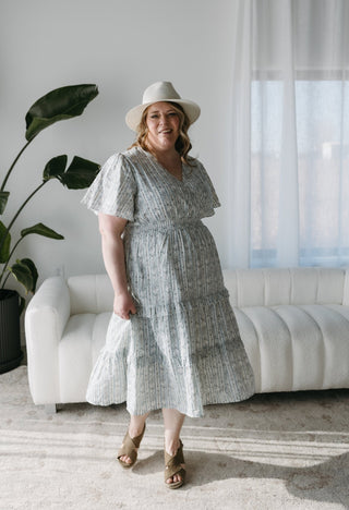 FEMININE PRINT FLUTTER SLEEVE FAUX WRAP MIDI DRESS - Love Marlow