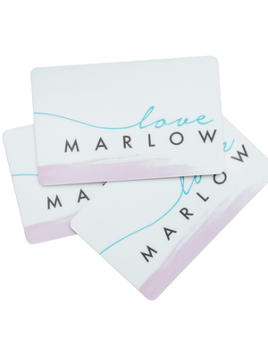 Three overlapping Gift Cards by Love Marlow, each adorned with the text "love Marlow" in blue and black. The cards feature a delicate faint pink section at the bottom, adding a touch of luxury to their design.