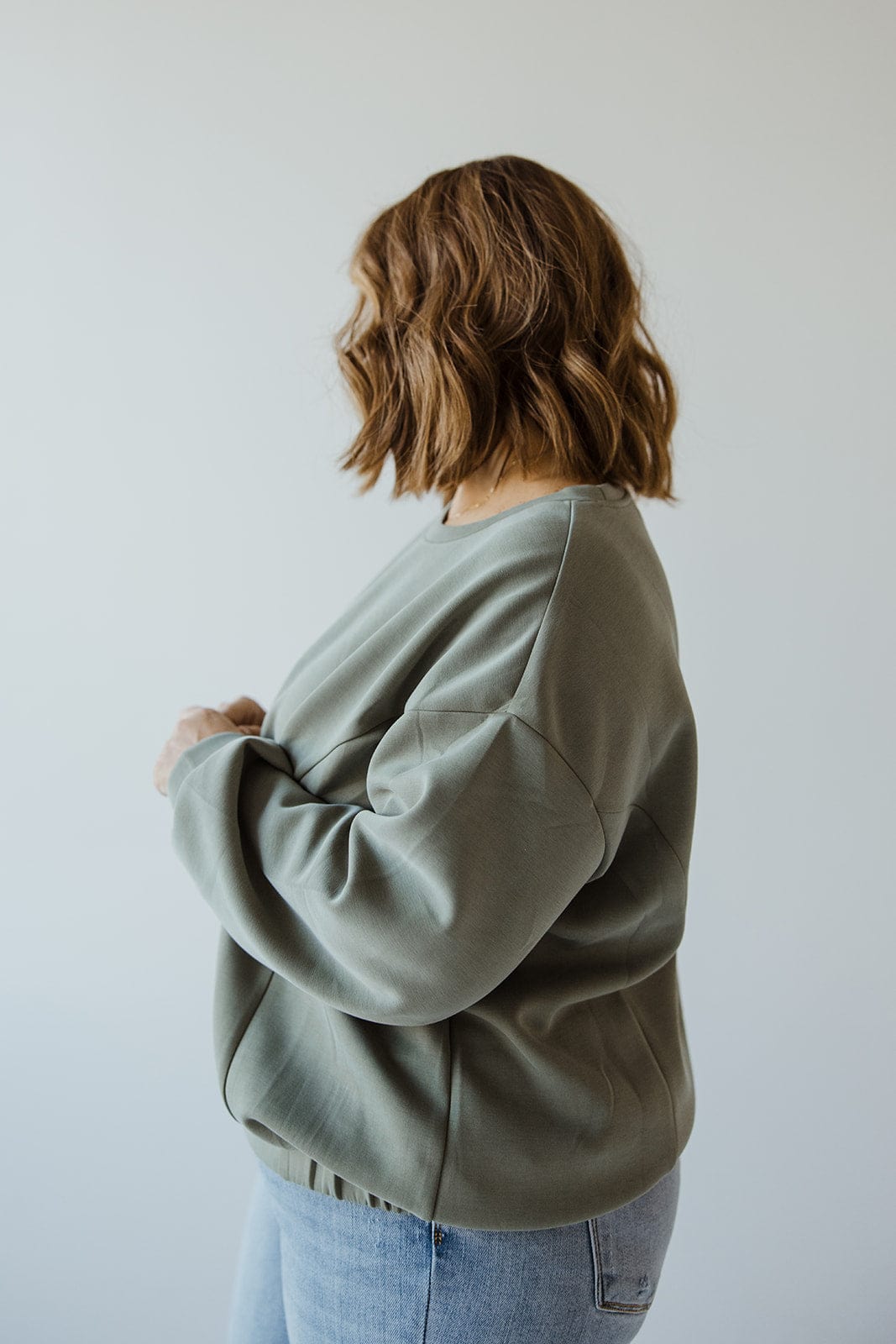 LIGHT AS AIR BANDED HEM SWEATSHIRT IN GREYED ARMY - 12 - Love Marlow