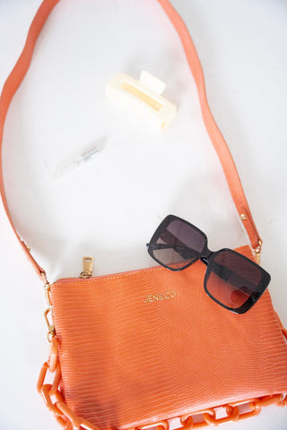 MEDIUM LIZARD PRINT CLUTCH IN CORAL - Love Marlow