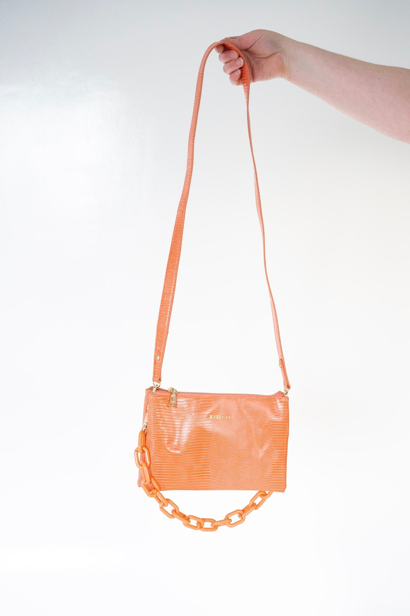 MEDIUM LIZARD PRINT CLUTCH IN CORAL - Love Marlow