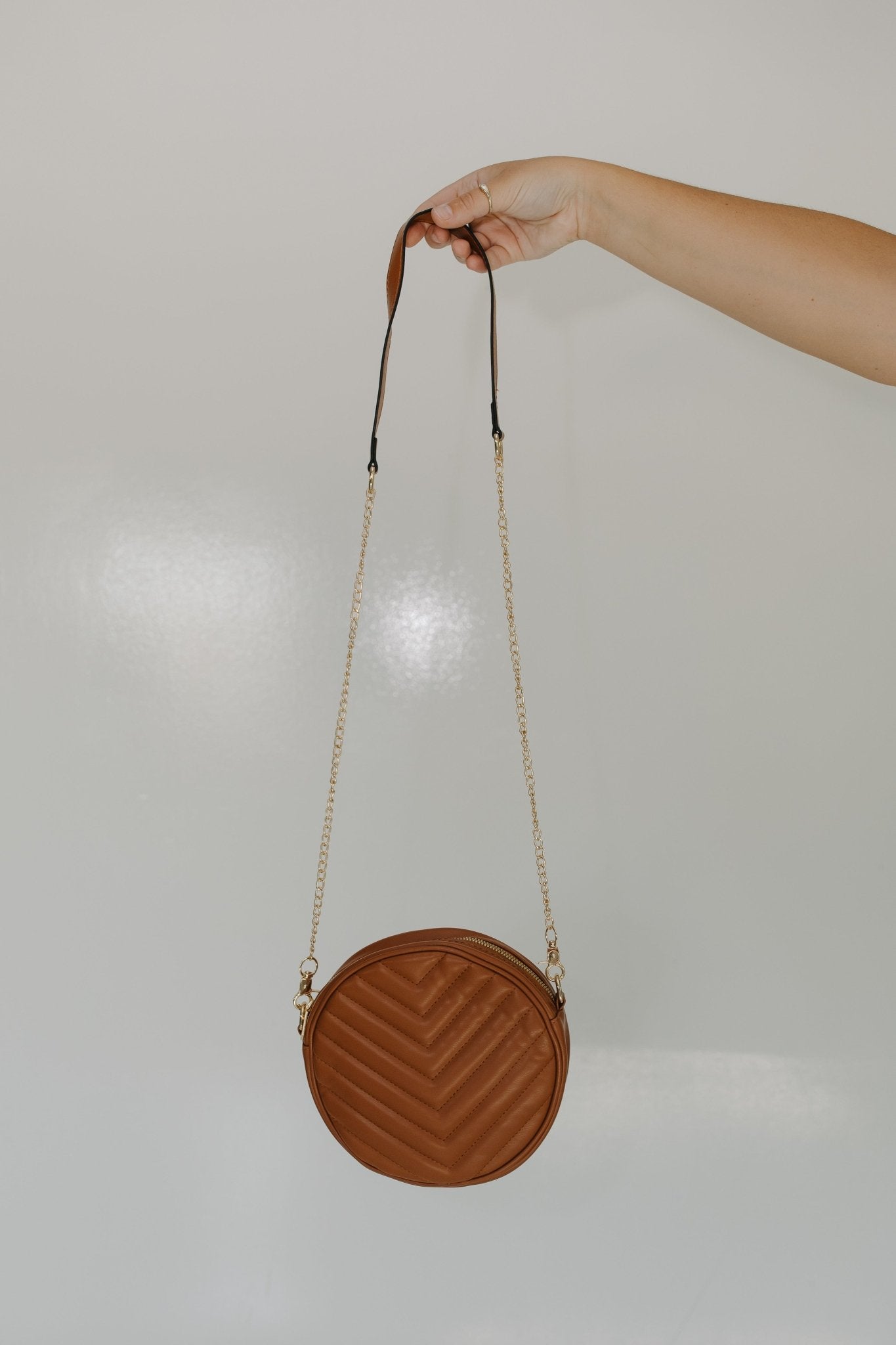 ROUND QUILTED CROSSBODY PURSE IN BROWN LIGHTWEIGHT FAUX LEATHER WITH GOLD CHAIN STRAP - Love Marlow