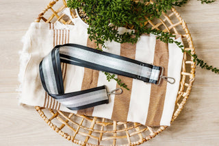 SHIMMERY STRIPE GUITAR SHOULDER STRAP IN BLACK
Detachable purse or bag adjustable strap with silver hardware. Striped silver shimmer strap.