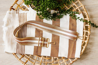 SHIMMERY STRIPE GUITAR SHOULDER STRAP IN KHAKI
Detachable purse or bag adjustable strap with gold hardware. Striped copper shimmer strap.