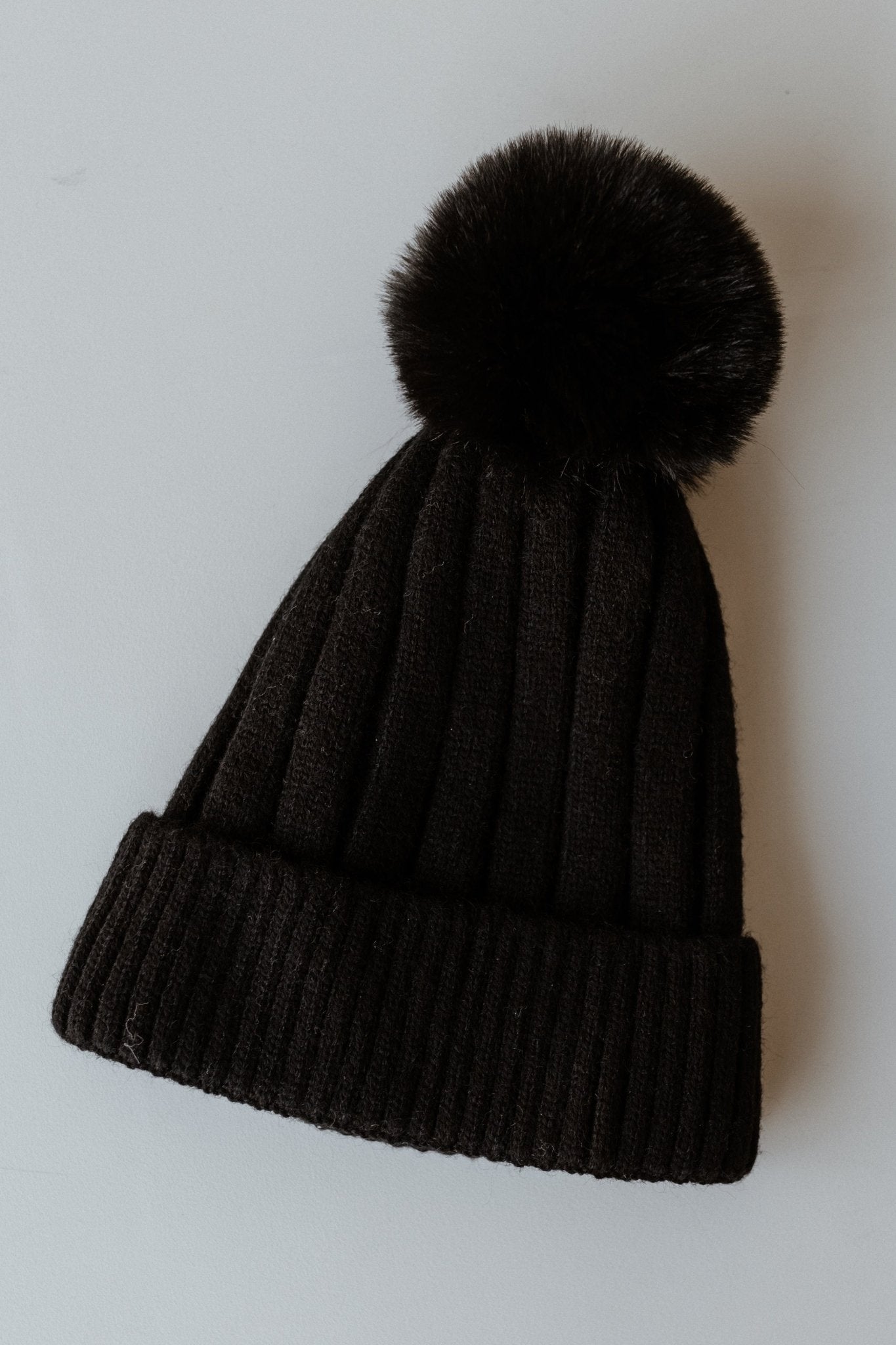 SOLID RIBBED KNIT BEANIE WITH PUFF IN BLACK - Love Marlow