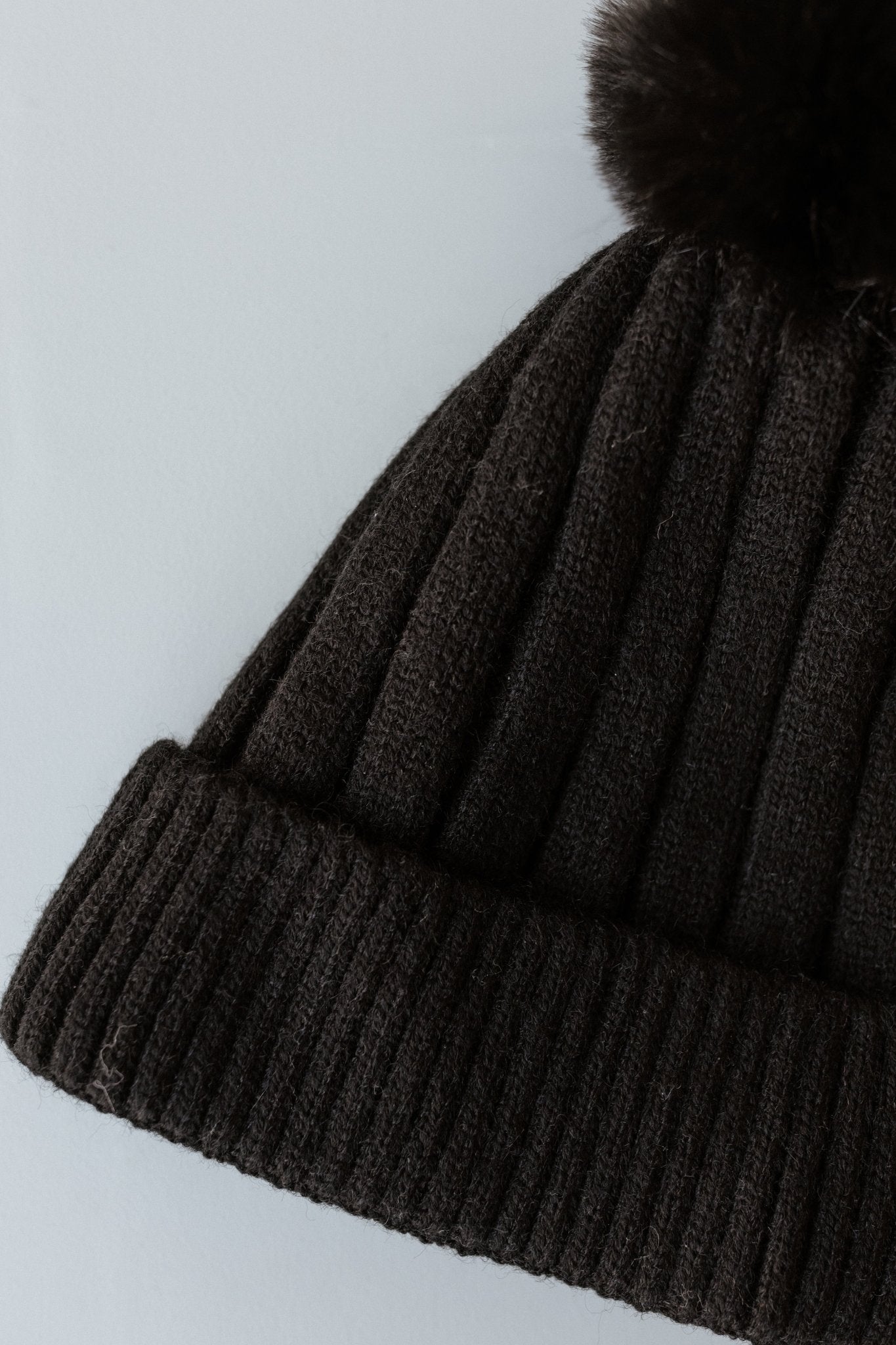 SOLID RIBBED KNIT BEANIE WITH PUFF IN BLACK - Love Marlow