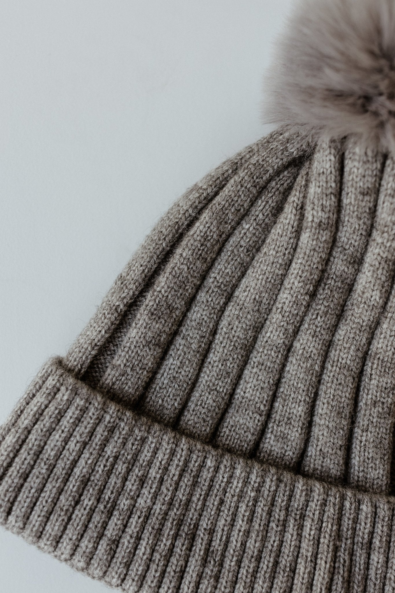 SOLID RIBBED KNIT BEANIE WITH PUFF IN GREY - Love Marlow