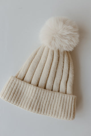 SOLID RIBBED KNIT BEANIE WITH PUFF IN IVORY - Love Marlow
