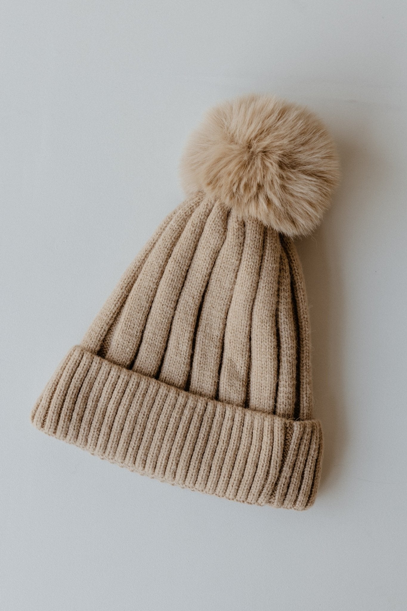 SOLID RIBBED KNIT BEANIE WITH PUFF IN TAUPE - Love Marlow