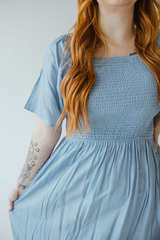 SOLID SMOCKED BODICE DRESS IN FADED DENIM SHEEN - Love Marlow
