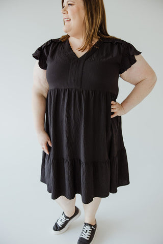 SOLID WOVEN TIERED DRESS WITH FLUTTER SLEEVE IN BLACK - Love Marlow