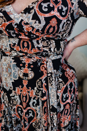 
            
                Load image into Gallery viewer, BAROQUE PATTERN WRAP DRESS IN BLUSH AND BLACK
            
        