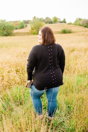 CLASSIC CREWNECK SWEATER WITH EYELET BACK DETAIL IN BLACK