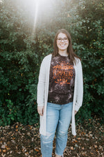 Close up of plus size long-sleeved graphic tee saying, "I like my attitude how I like my pumpkins with extra spice."