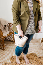 TEXTURED SNAKE PRINT BUCKET BAG IN BEIGE