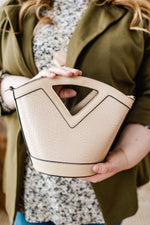 TEXTURED SNAKE PRINT BUCKET BAG IN BEIGE