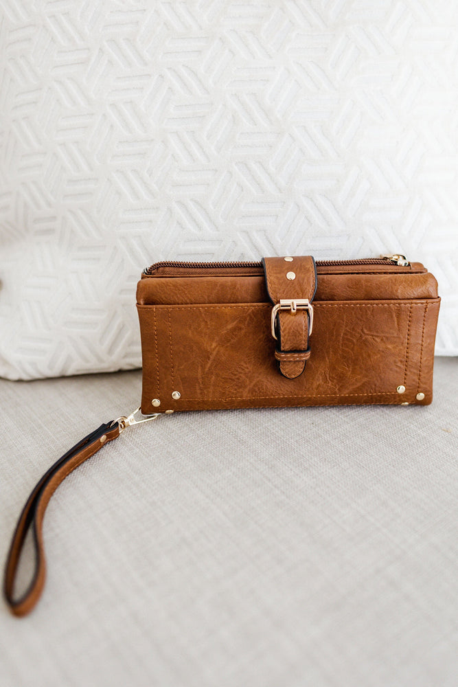WRISTLET WALLET WITH BUCKLE DETAIL IN SADDLE