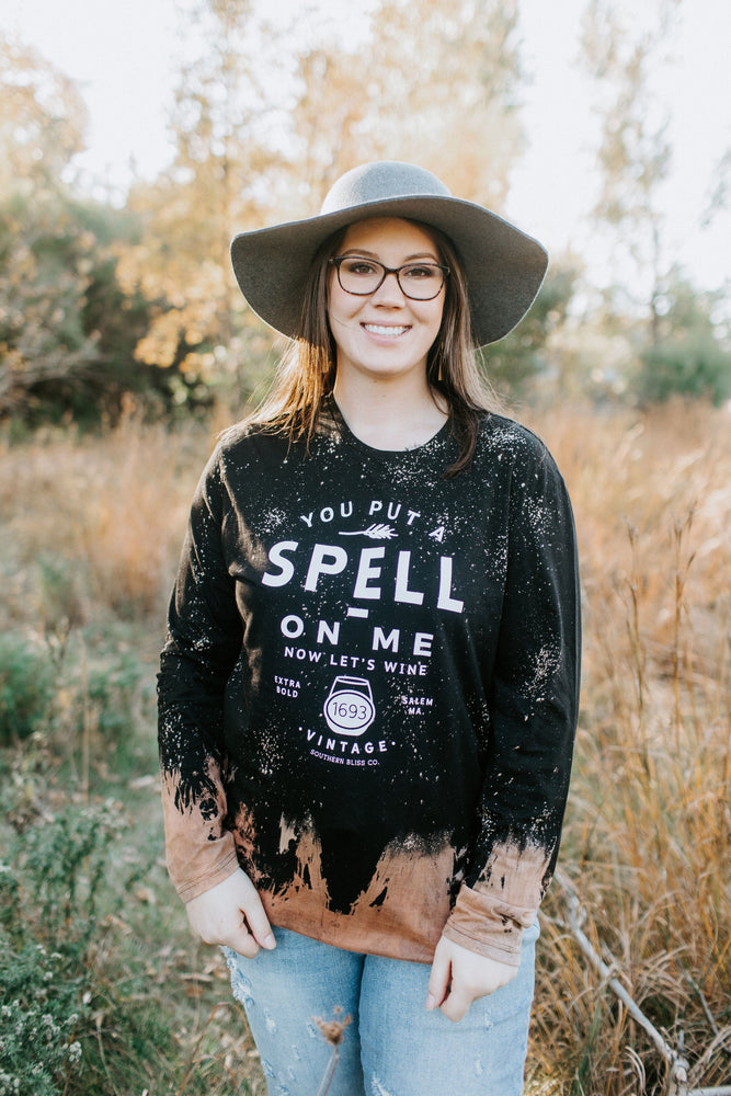 "YOU PUT A SPELL ON ME NOW LET'S WINE" LONG SLEEVE GRAPHIC TEE